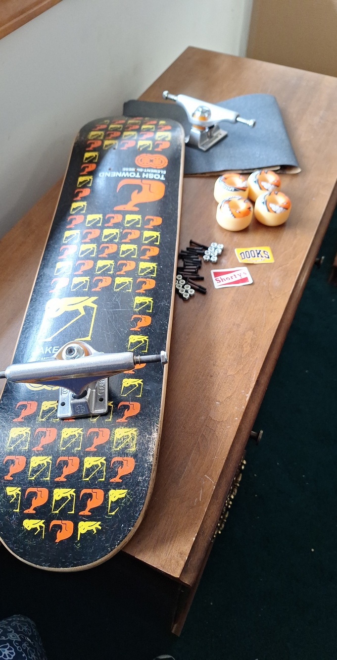 Townend Black Graphic Skateboard Complete with Orange Wheels, Stickers, Risers
